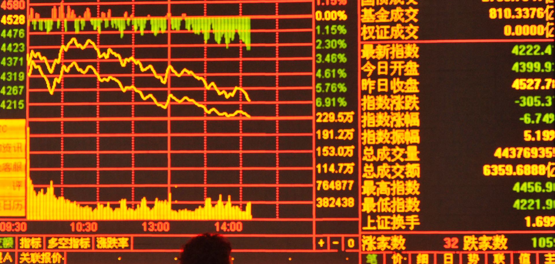 An investor watches the stock market at a stock exchange hall June 26 in Fuyang, China.