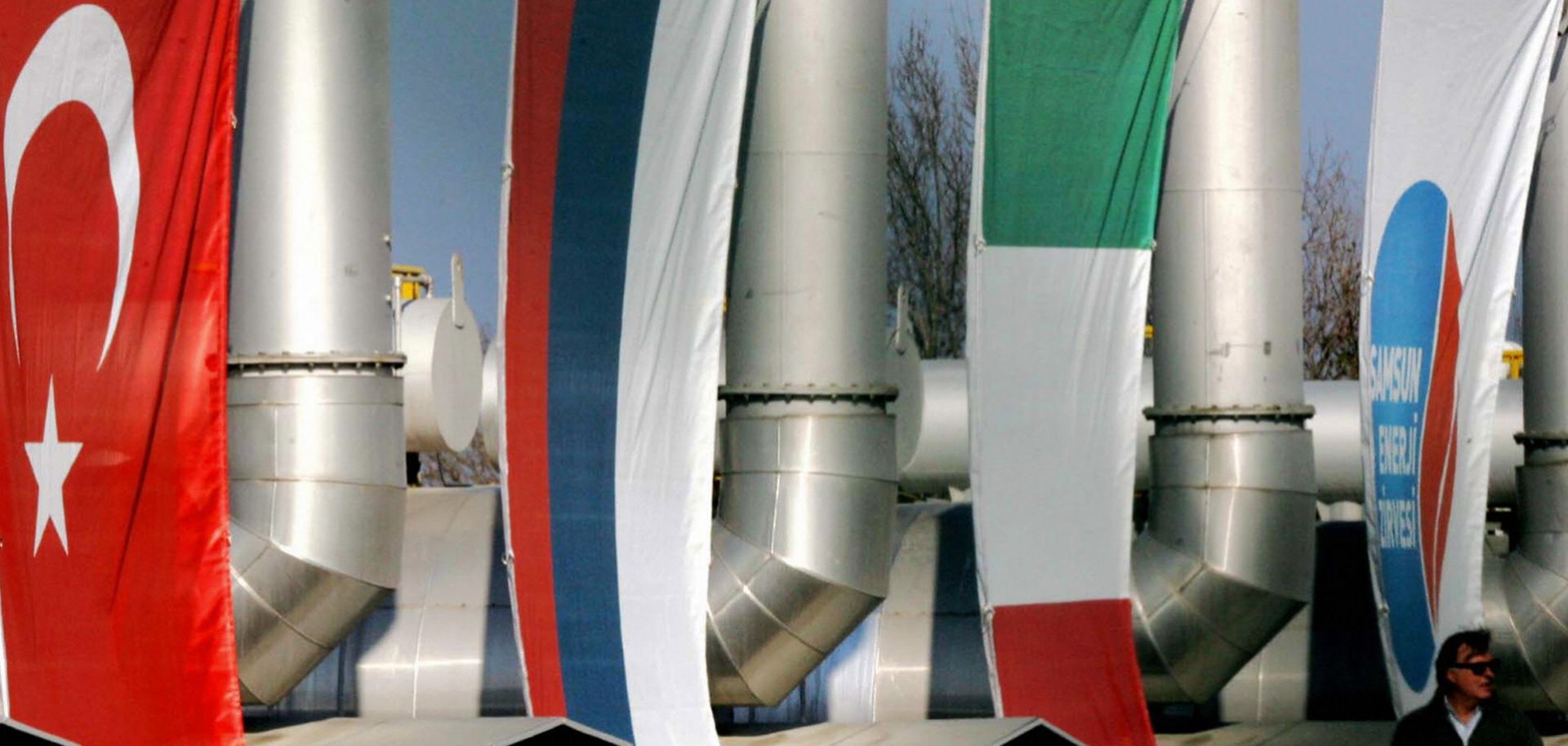 Flags of Turkey, Russia and Italy hang on the Blue Stream natural gas pipeline in Samsun, Turkey. (MUSTAFA OZER/AFP/Getty Images)