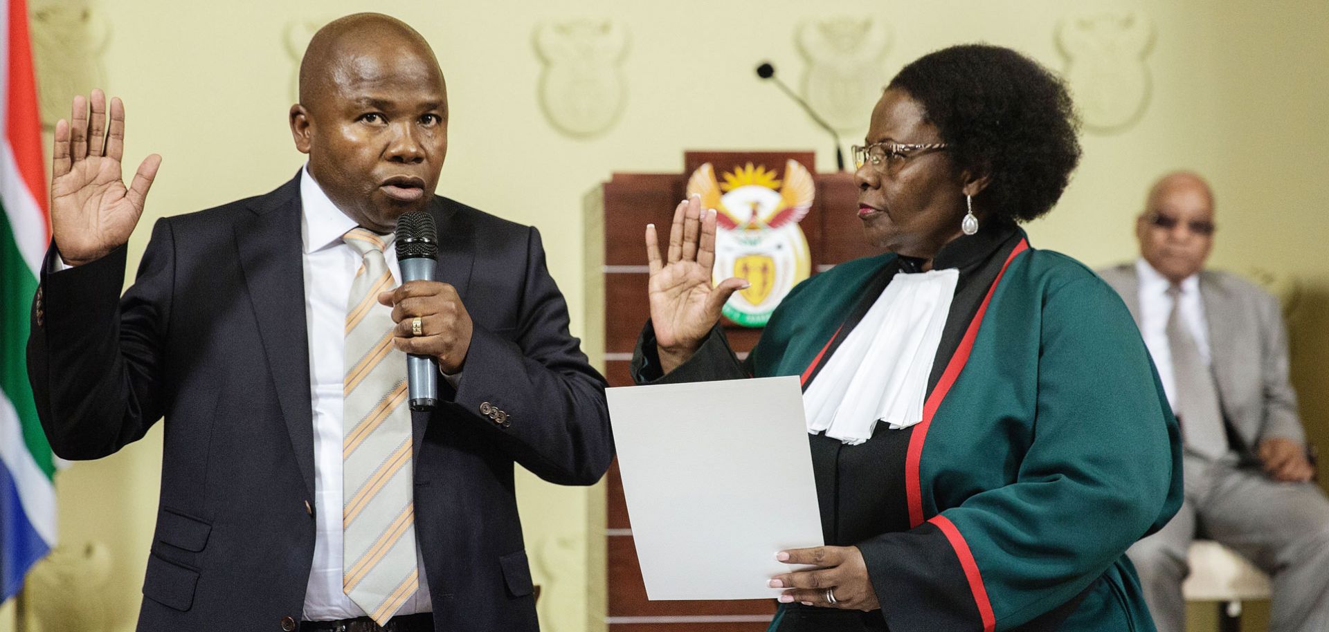 David Des van Rooyen (L) is sworn as the new South African Finance Minister by Justice Minister Sisi Khampepe on Dec. 10.