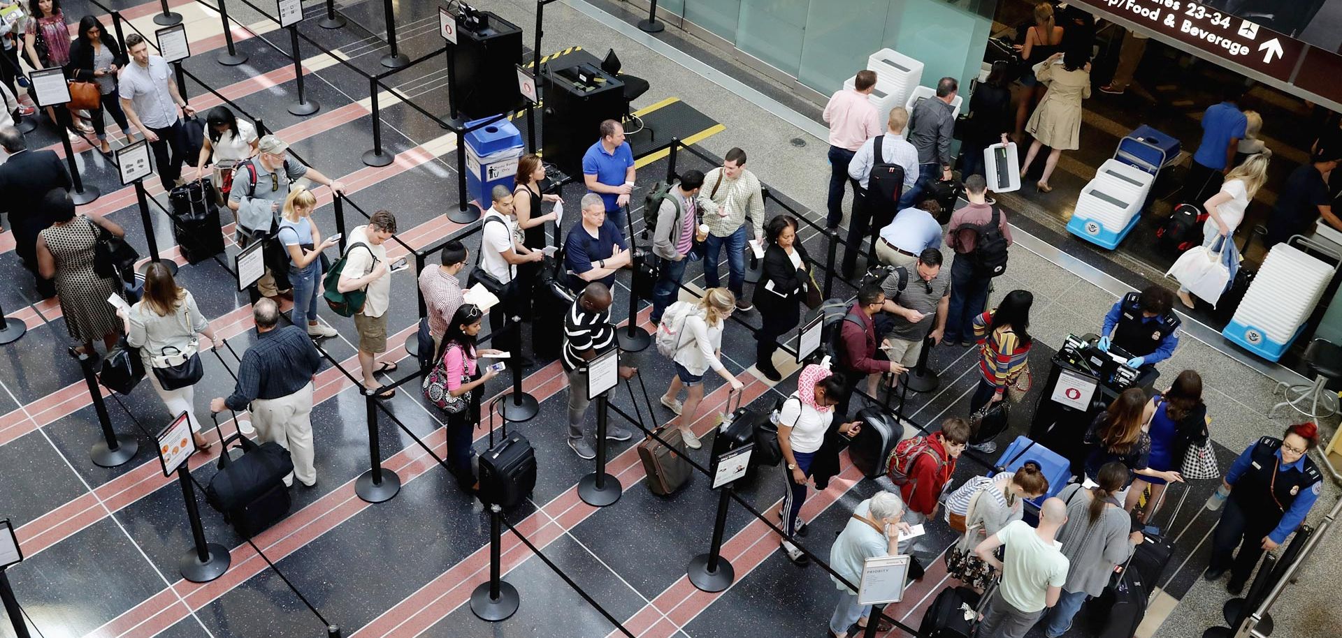 Passengers wait at a Transportation Security Administration checkpoint at Ronald Reagan National Airport in Arlington, Virginia. Preparation is the first step in making sure that your trip is safe and enjoyable.