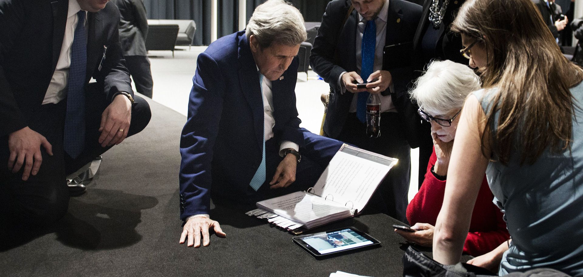 U.S. Secretary of State John Kerry (2nd L) watches the President of the United States address the nation after Iran nuclear program talks finished with extended sessions in Lausanne, Switzerland, April 2.
