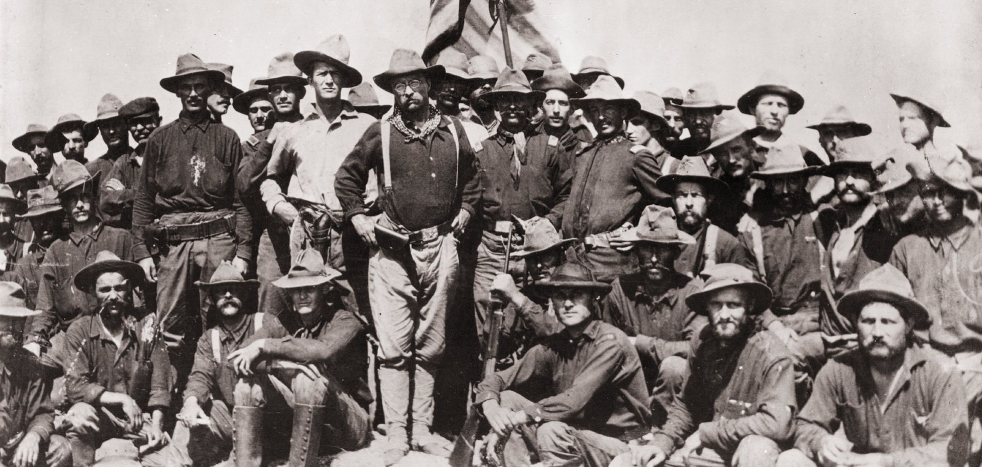 Theodore Roosevelt stands with the First Cavalry Volunteers on San Juan Hill during the Spanish-American War. 