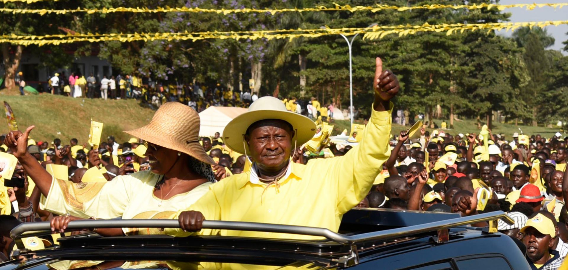 Ugandan President Yoweri Museveni, riding with his wife to a campaign rally Feb. 16, has used his government's control over the nation's resources to remain in power for decades.