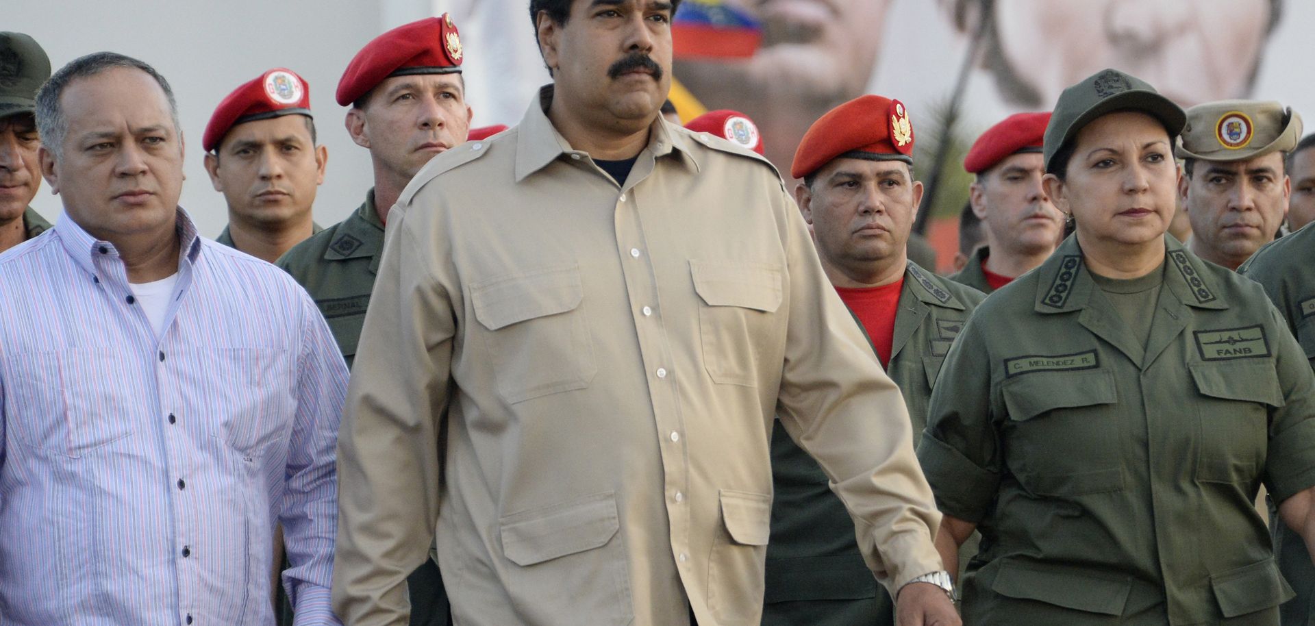 Venezuelan President Nicolas Maduro (C), Venezuelan Parliament President Diosdado Cabello (L) and then-Defense Minister Carmen Melendez (R) attend a military ceremony in Caracas on Dec. 27, 2013. 