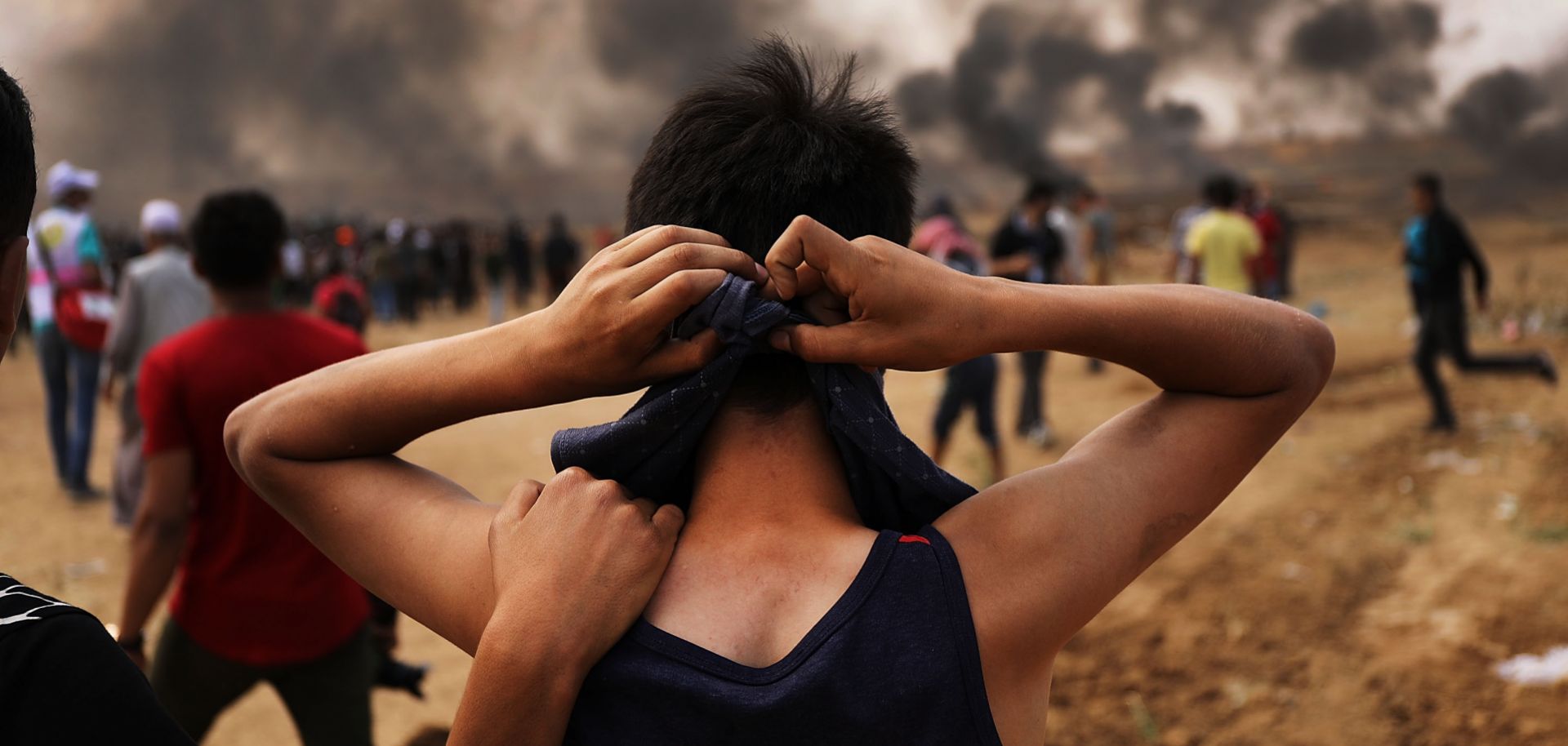 A Palestinian teenager prepares to head to the border fence with Israel amid mass demonstrations against the opening of the U.S. embassy in Jerusalem on May 14 -- the day before Ramadan -- in Gaza City.