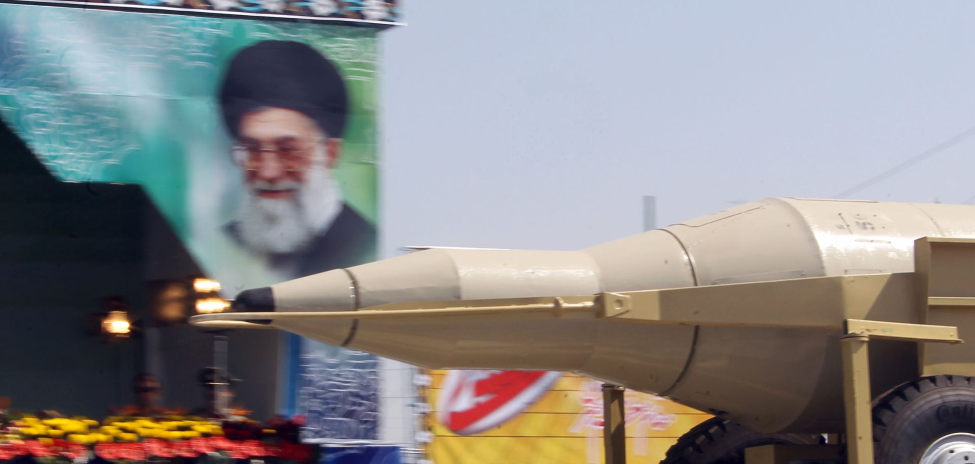 An Iranian military truck carries a Sejjil missile past a portrait of Supreme Leader Ayatollah Ali Khamenei during a Sept. 22, 2013, military parade in Tehran marking the anniversary of the start of the 1980-88 Iran-Iraq war.
