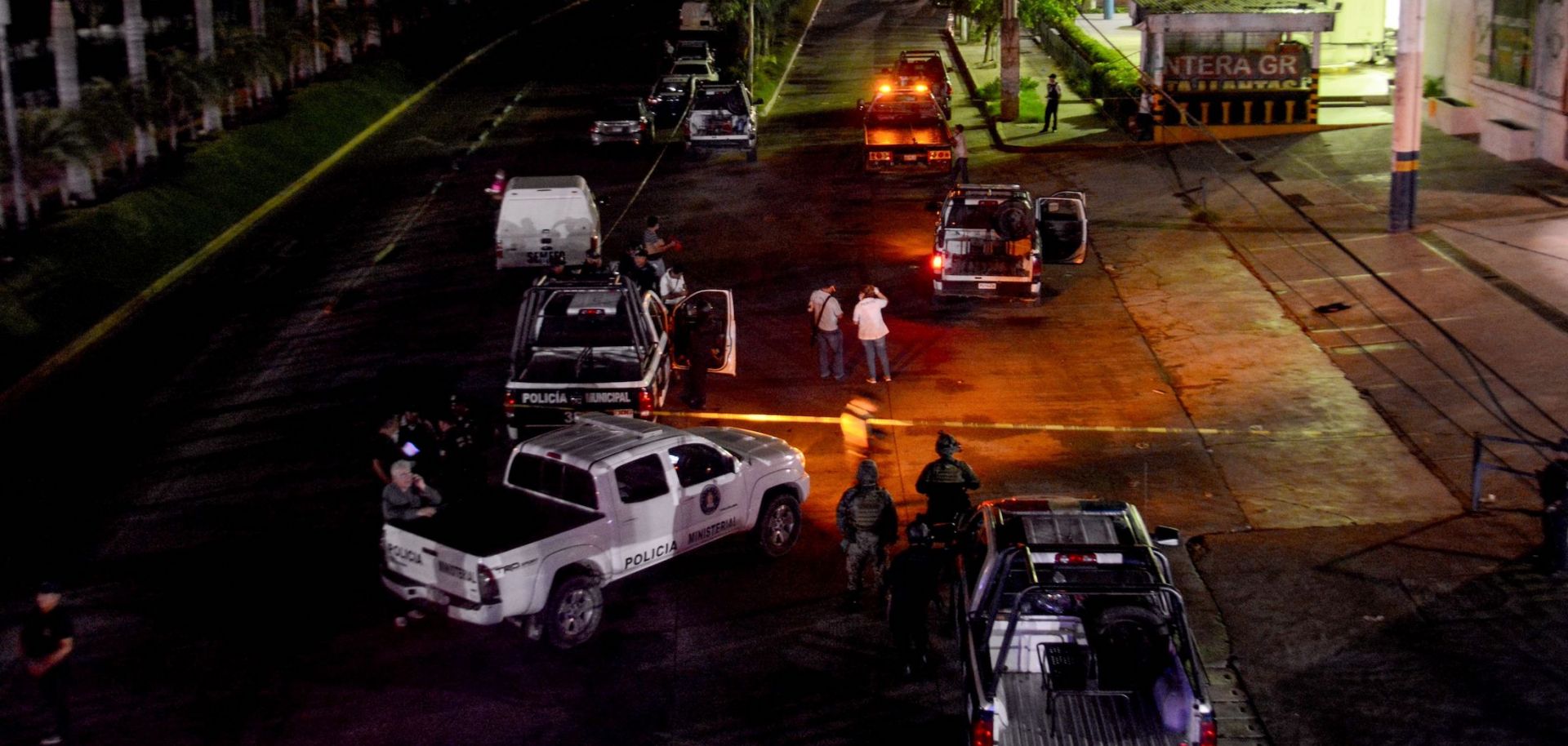 In this photograph, police investigate the killing of a colleague in Acapulco, Mexico, on July 23, 2018.