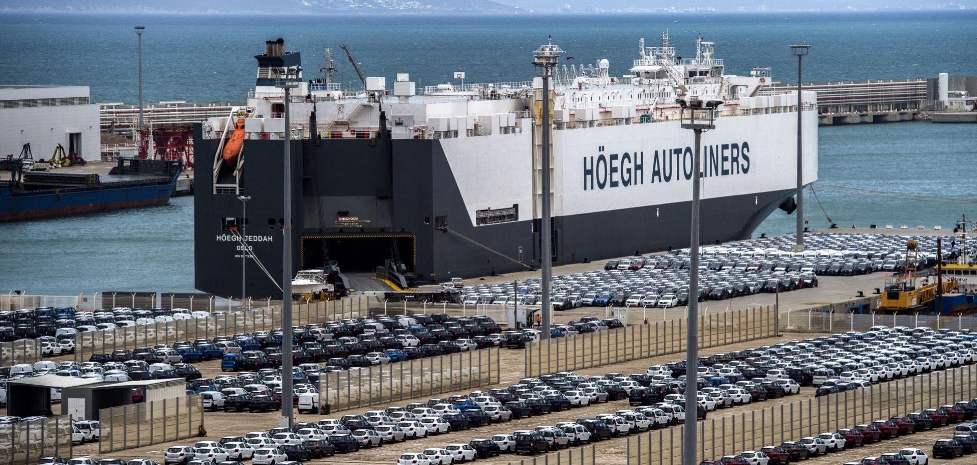 A picture taken on March 12, 2018, shows a ship docked at the Tanger Med container port and Renault terminal in Ksar Sghir, near the northeastern Moroccan port city of Tangiers overlooking the Strait of Gibraltar.