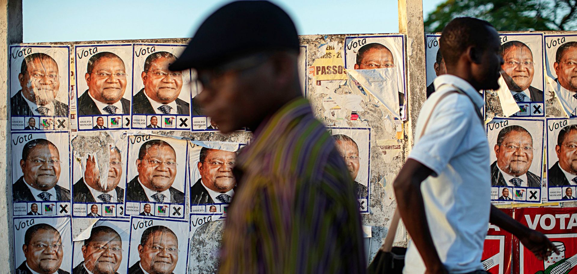 Posters for Renamo's presidential candidate, Ossufo Momade, line a wall ahead of Mozambique's Oct. 15 polls. 