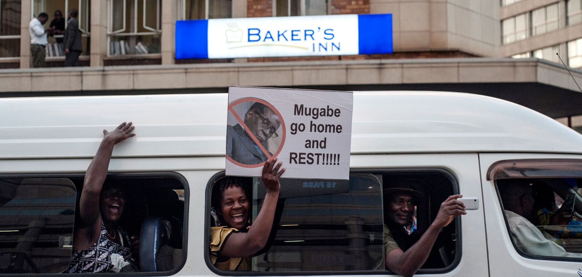 People in the Zimbabwean capital of Harare celebrate longtime President Robert Mugabe's resignation Nov. 21.