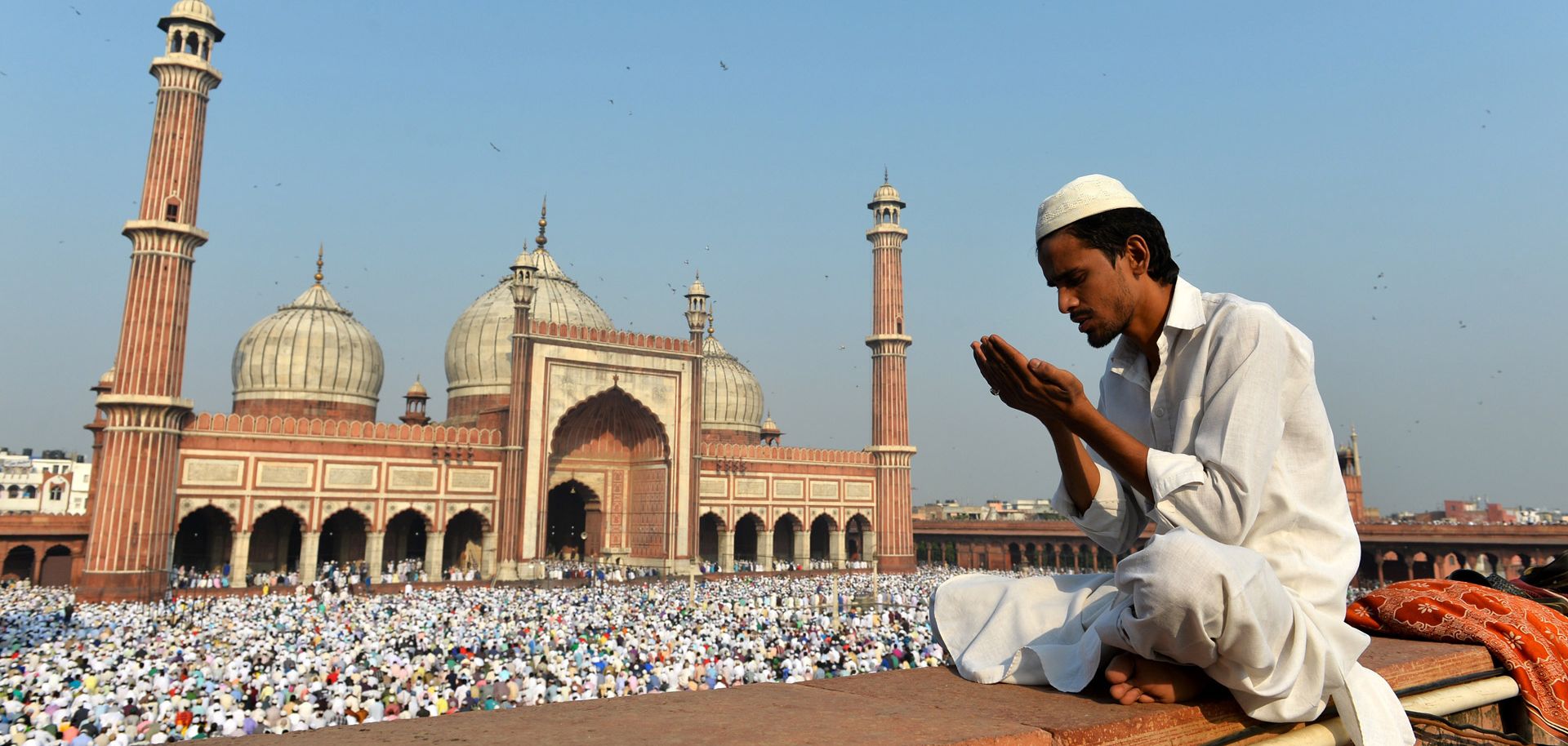 An Indian Muslim devotee offers prayers during Eid al-Adha at Jama Masjid in New Delhi on October 6, 2014. Muslims across the world are preparing to celebrate the annual festival of Eid al-Adha, or the Festival of Sacrifice, which marks the end of the Hajj pilgrimage to Mecca and in commemoration of Prophet Abraham's readiness to sacrifice his son to show obedience to God.