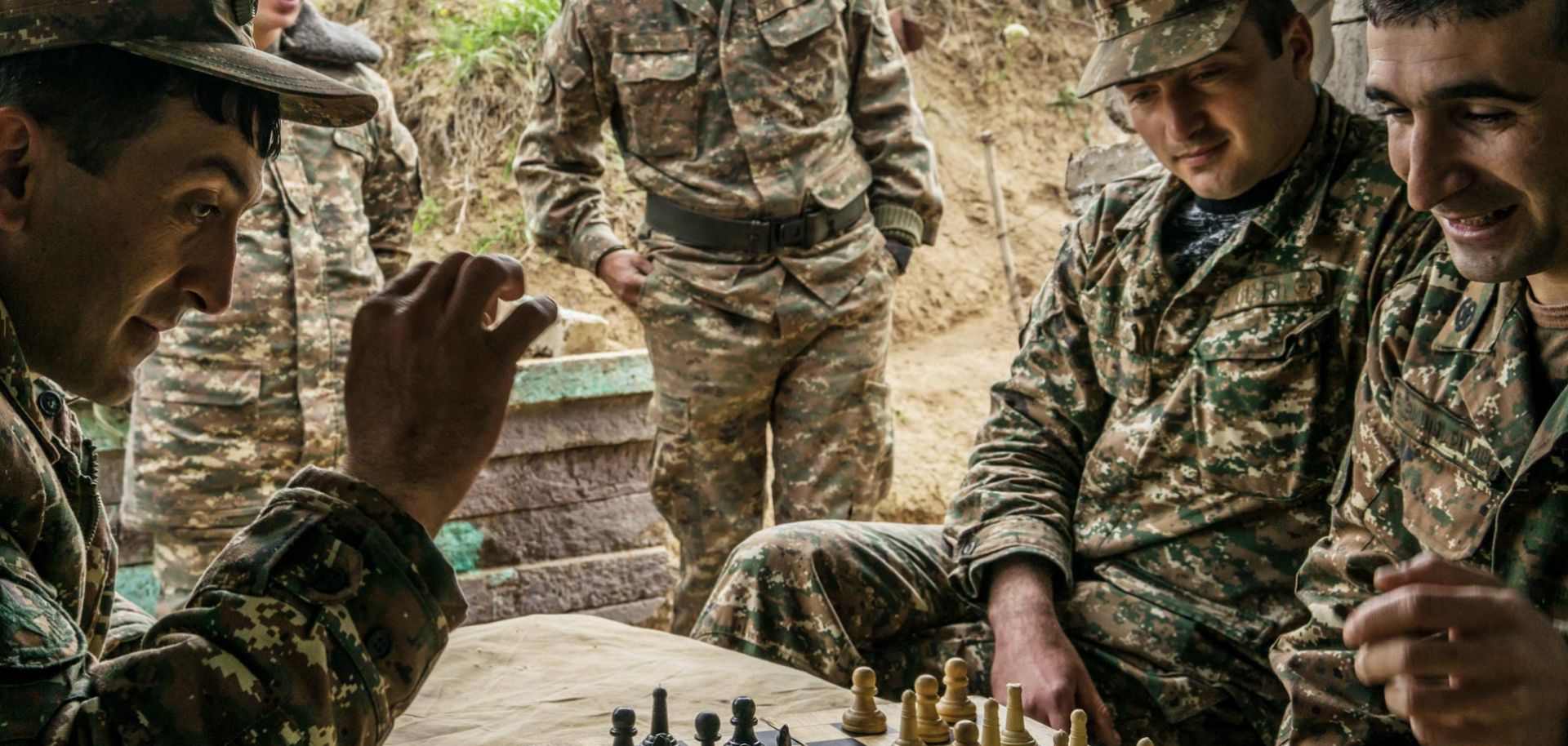 Soldiers in Nagorno-Karabakh play checkers using a chess set at their post along the line of contact with Azerbaijan on April 21.
