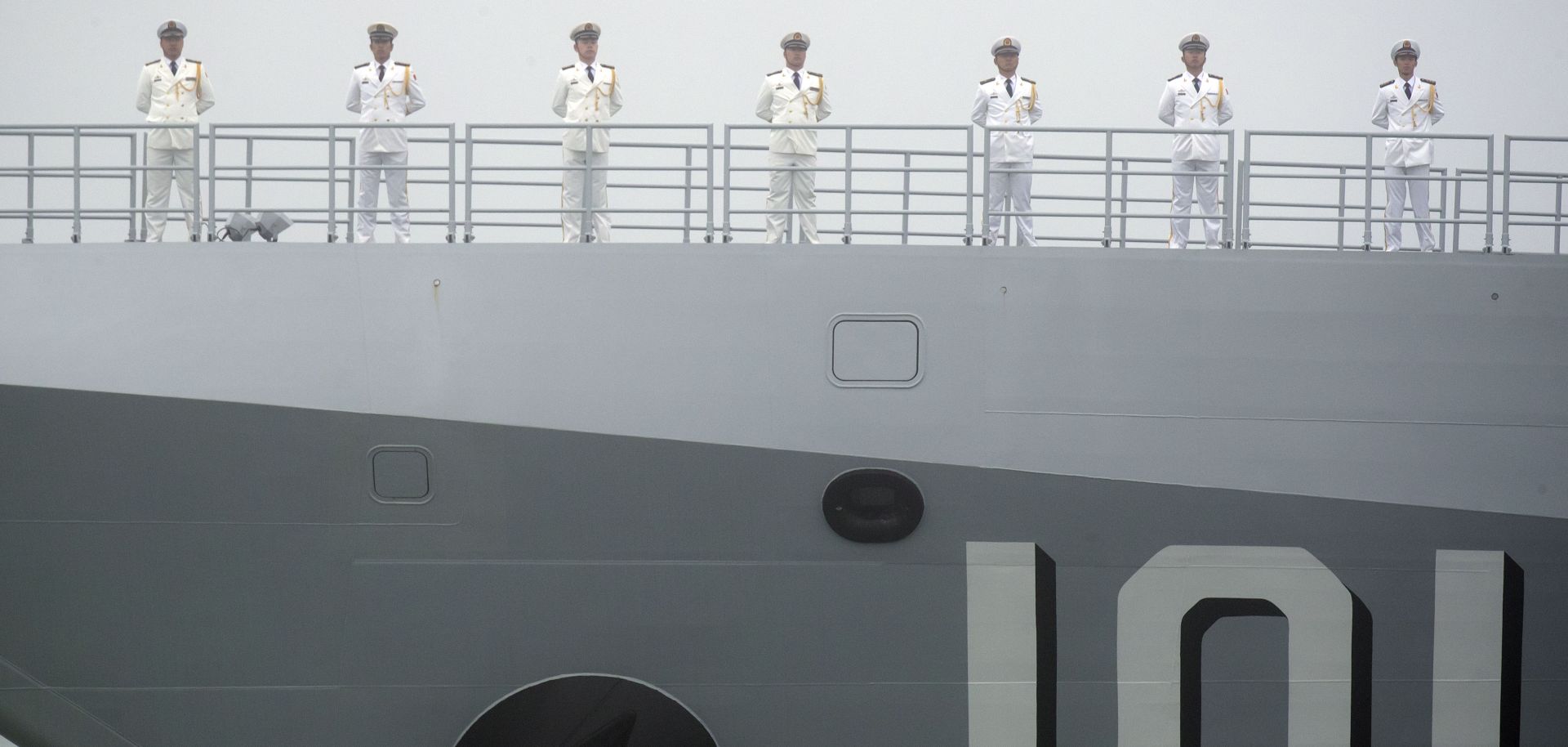 Sailors stand on the deck of the new type 055 guided missile destroyer Nanchang, belonging to the Chinese People's Liberation Army (PLA) Navy. China staged a naval parade on April 23 to commemorate the 70th anniversary of the founding of China's PLA Navy. 