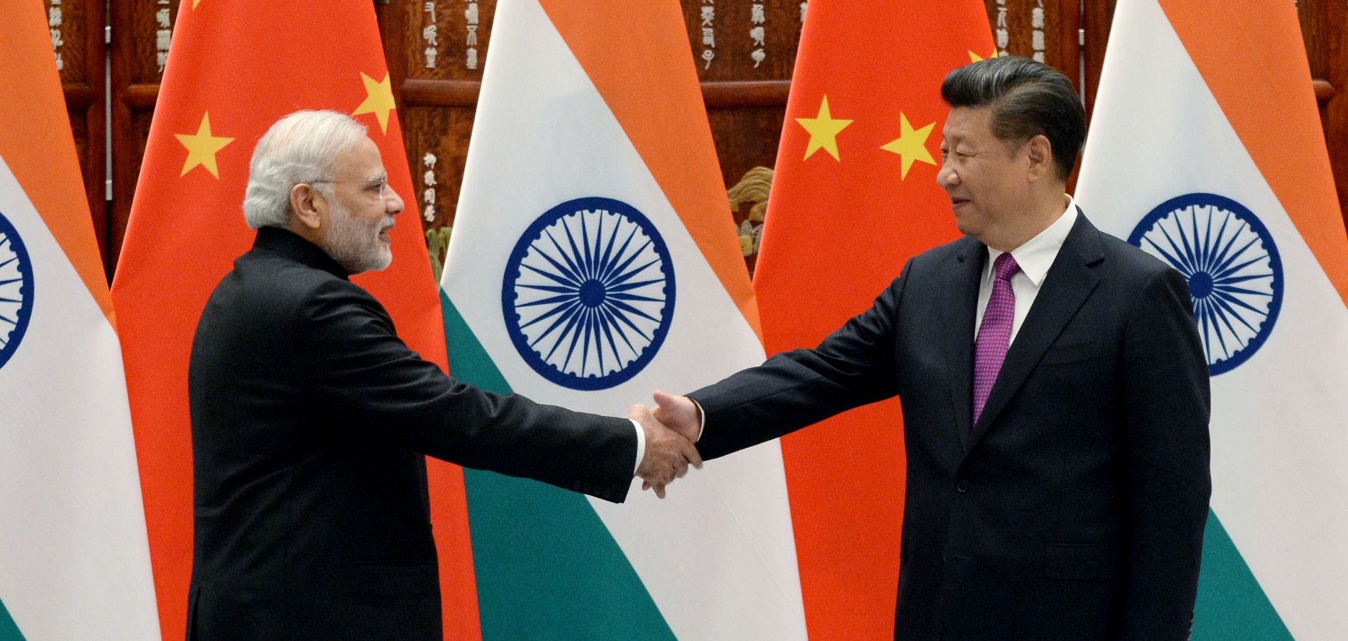 Indian Prime Minister Narendra Modi, left, shakes hands with Chinese President Xi Jinping on Sept. 4, 2016, in Hangzhou, China.