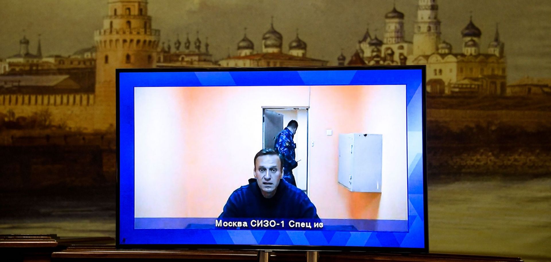 Russian opposition leader Alexei Navalny appears on a screen via a video link from Moscow's penal detention center during a court hearing of an appeal against his arrest in Krasnogorsk, Russia, on Jan. 28, 2021. 