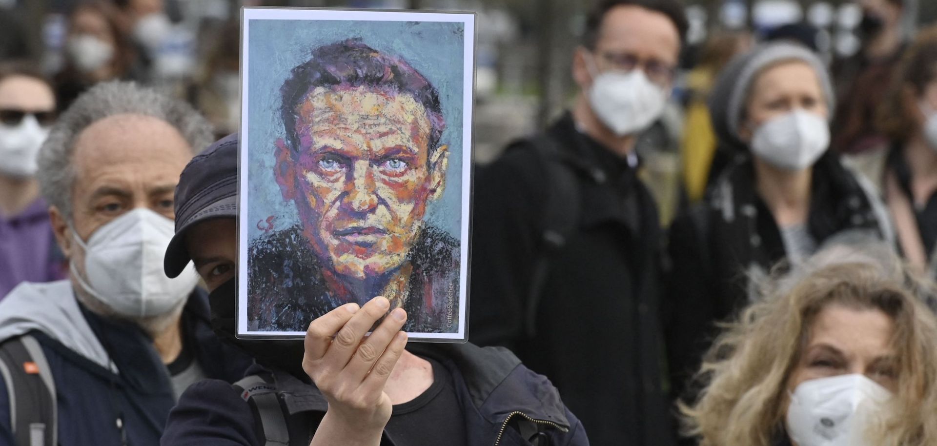 A demonstrator displays a portrait of Russian opposition leader Alexei Navalny during a protest in Berlin, Germany, on April 21, 2021.