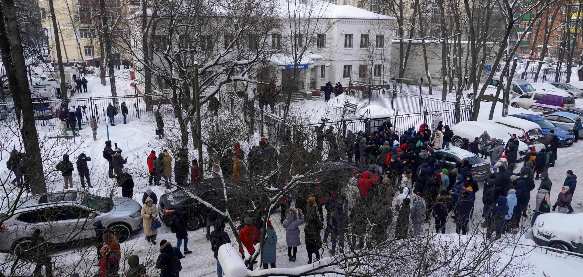 Journalists and supporters of Russian opposition leader Alexei Navalny gather near the police station where Navalny was held after being detained at the Moscow airport on Jan. 18, 2021, in Khimki, Russia. 