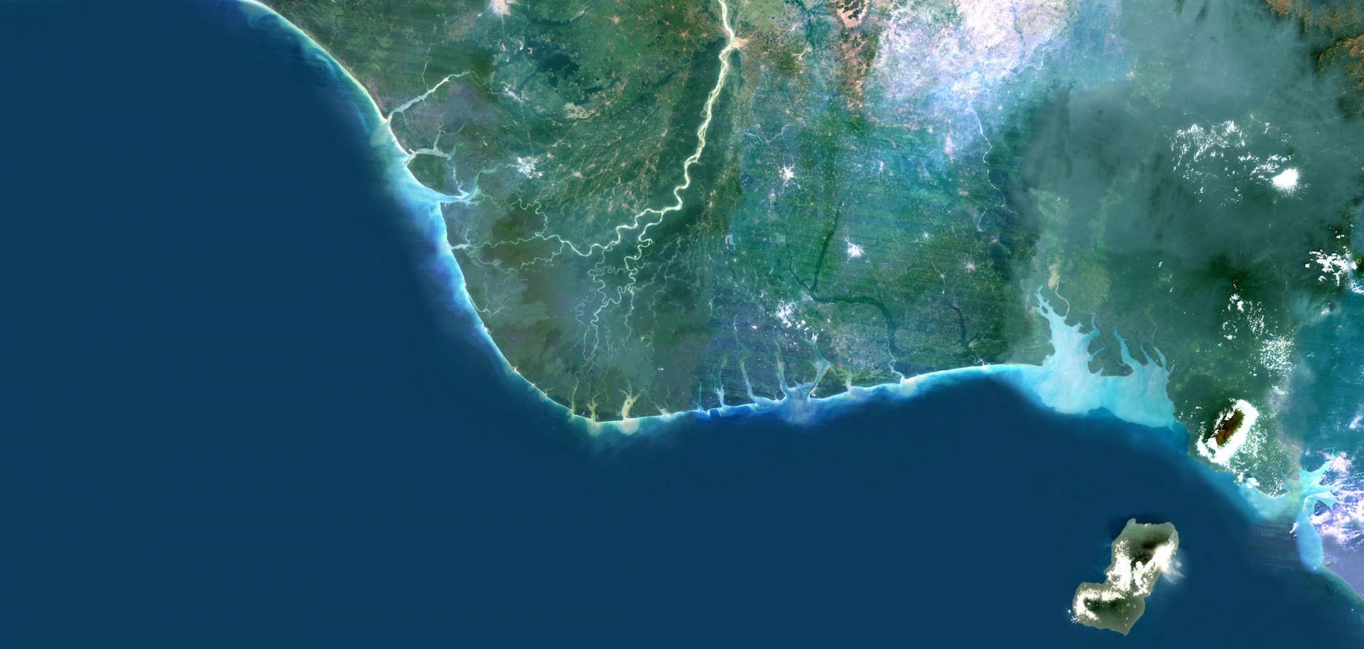 Color satellite image of the Niger Delta region in Nigeria. The city of Lagos, the second-most populous city in Africa, can be seen west of the river on the Atlantic coast.