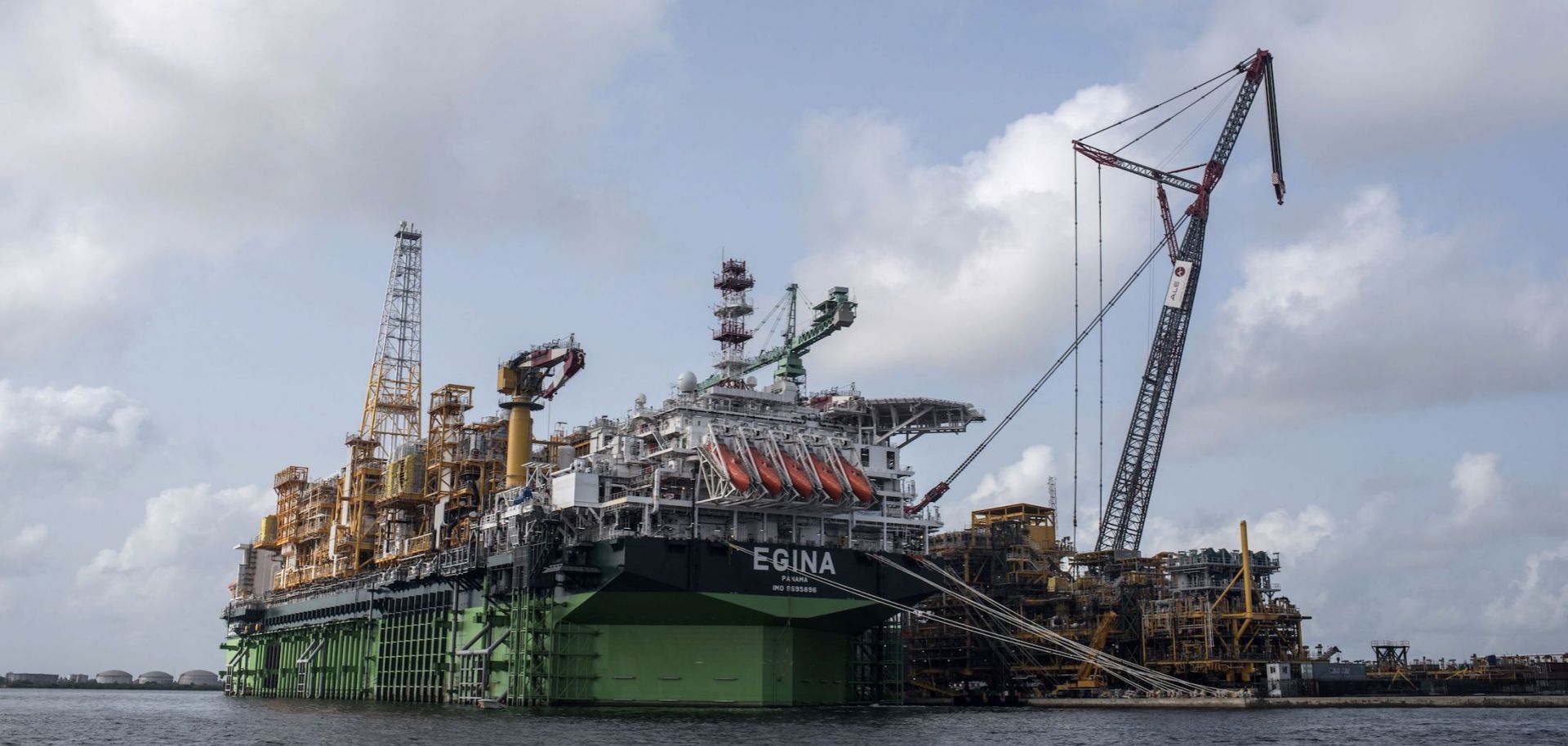 A photo shows the Egina FPSO (Floating Production Storage and Offloading) unit berthed at a harbor in Lagos, Nigeria. 