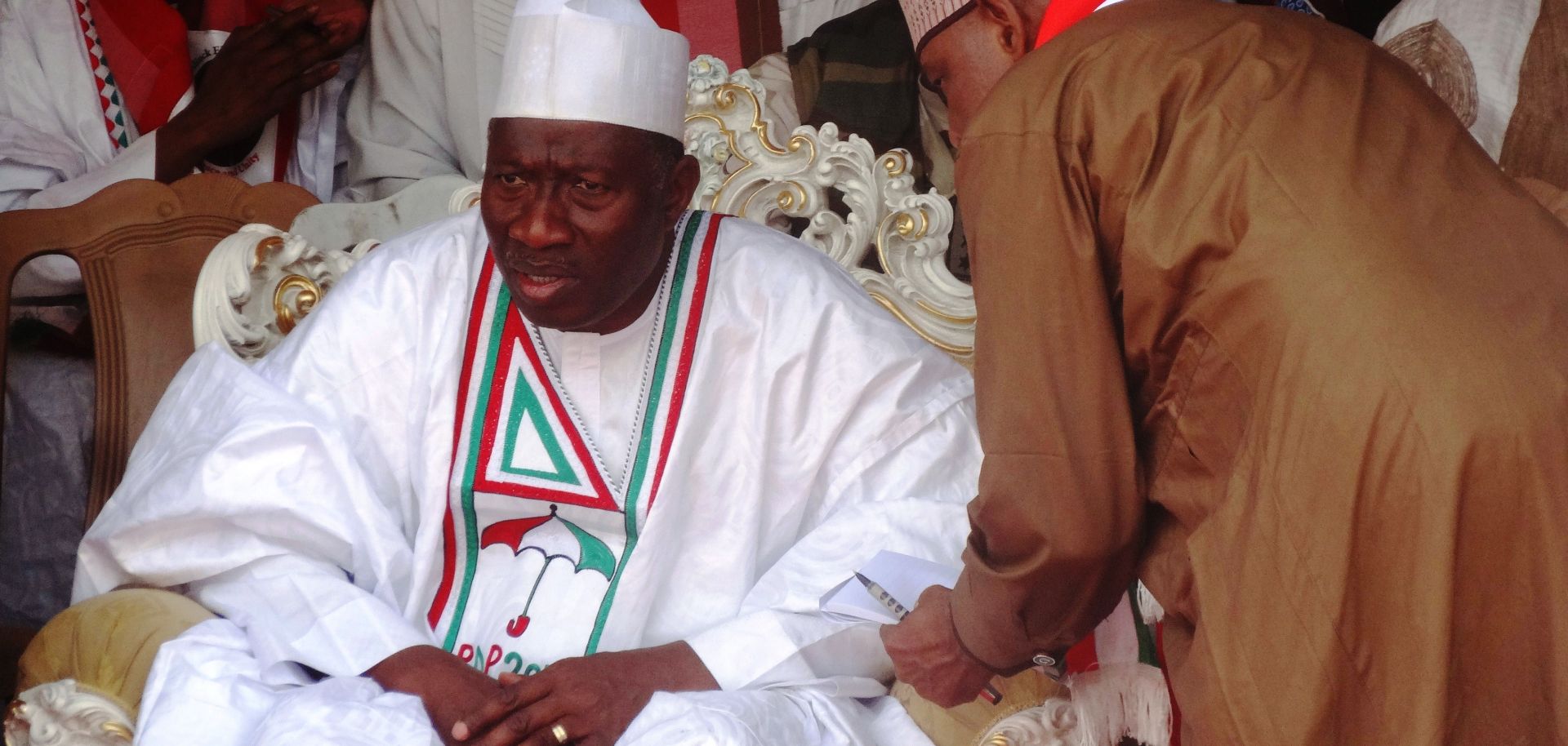 Nigeria's President and candidate for the Peoples Democratic Party Goodluck Jonathan speaks with a campaign aide.