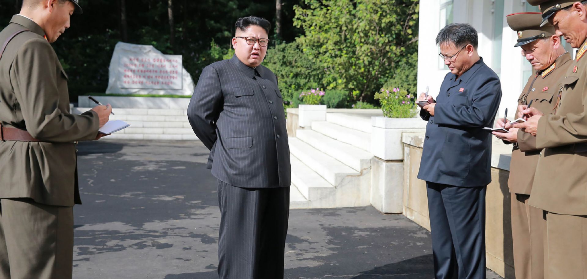 In this photo, North Korean leader Kim Jong Un visits the Chemical Material Institute of the Academy of Defense Science at an undisclosed location.