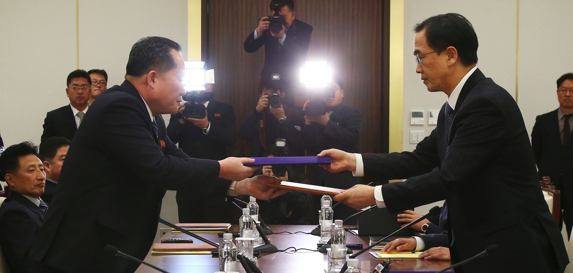 South and North Korean officials exchange joint statements Jan. 9 in the Demilitarized Zone after agreeing that athletes from North Korea would participate in the 2018 Winter Olympics in Pyeongchang, South Korea.