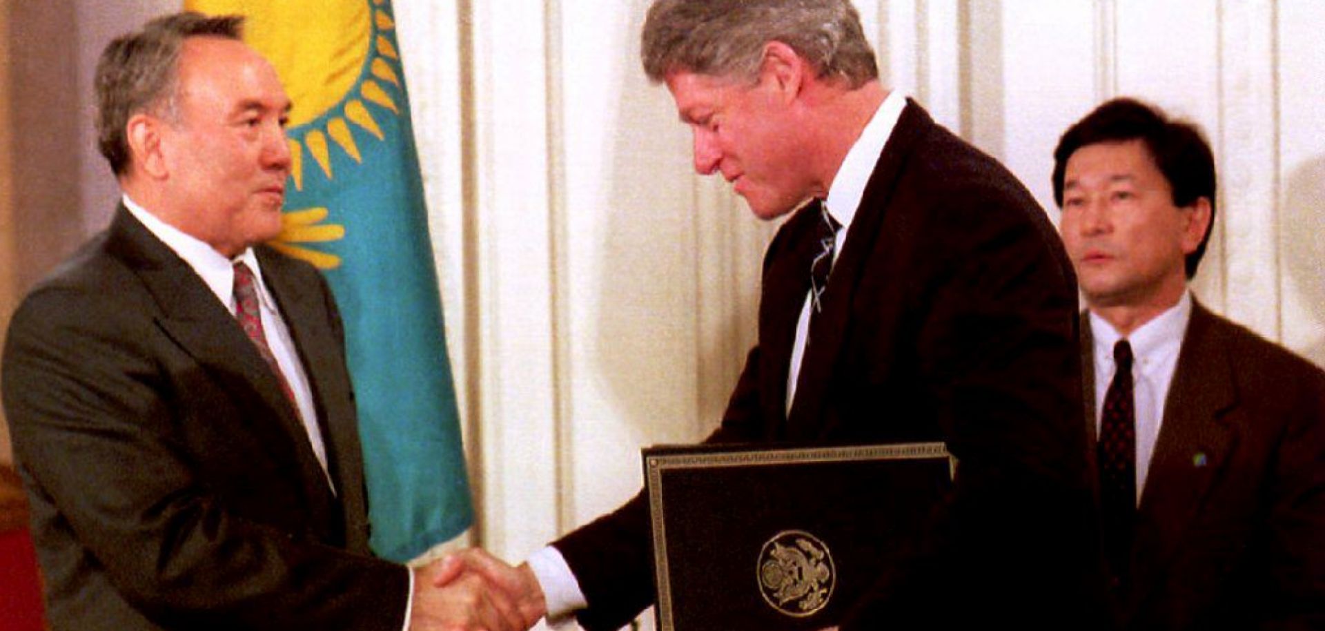 U.S. President Bill Clinton and Kazakh President Nursultan Nazarbayev shake hands at the White House on Feb. 14, 1994, after Nazarbayev presented Clinton with Kazakhstan's accession to the Nuclear Nonproliferation Treaty.