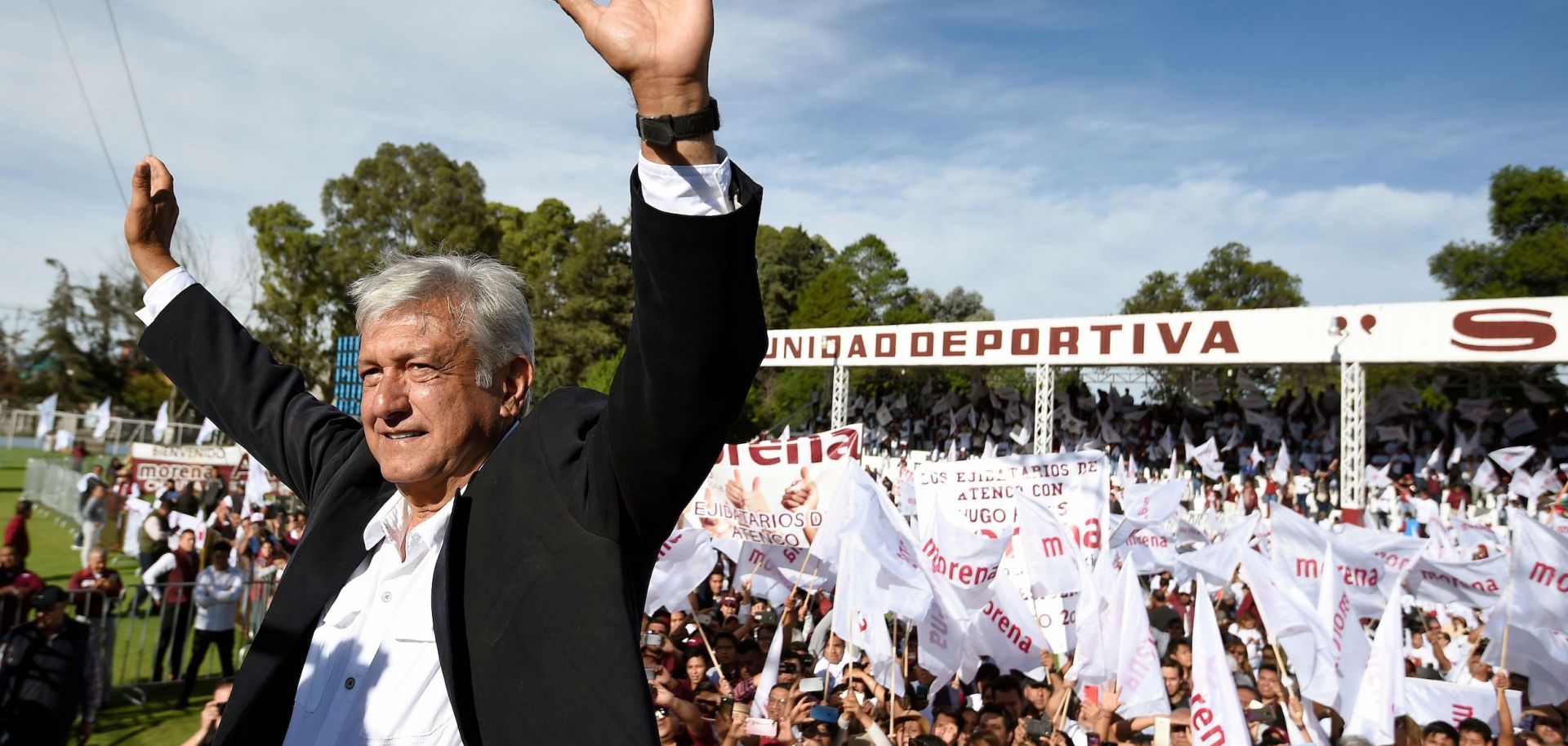 Mexican presidential candidate Andres Manuel Lopez Obrador stands at a campaign rally.