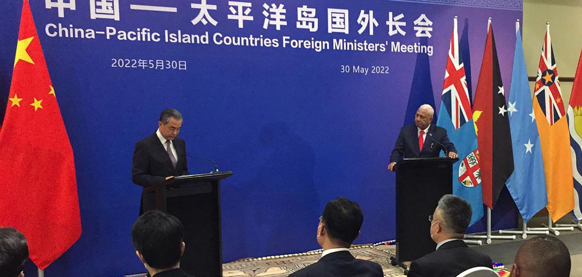 Visiting Chinese Foreign Minister Wang Yi (left) and Fiji's prime minister Frank Bainimarama attend a joint press conference in Fiji's capital of Suva on May 30, 2022.