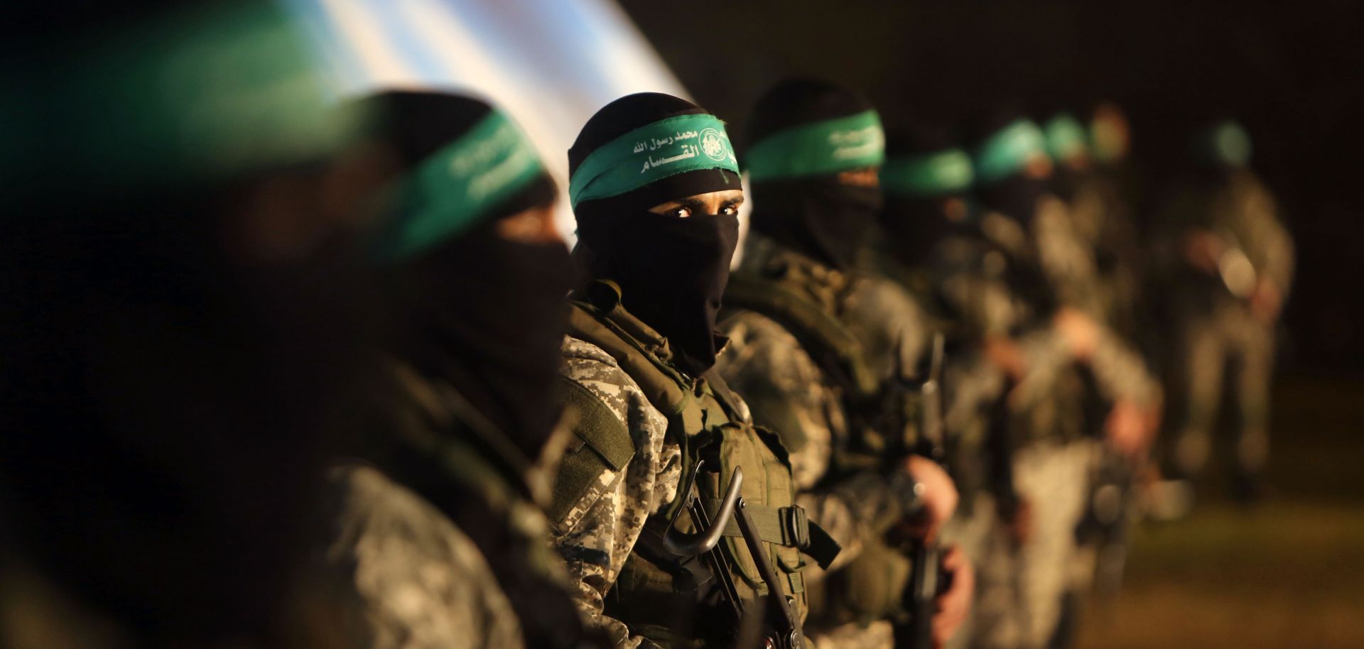 Palestinian members of the Ezzedine al-Qassam Brigades, the armed wing of the Hamas movement, take part in a gathering.