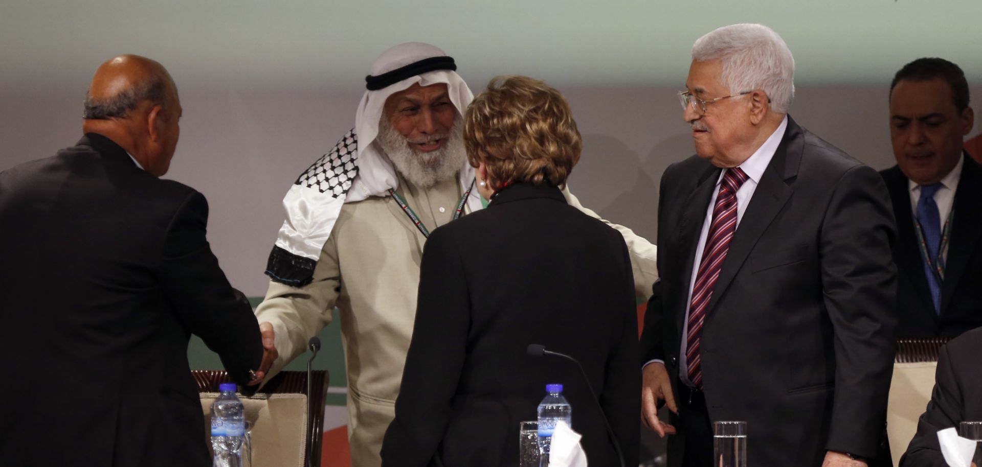 Palestinian President Mahmoud Abbas, right, greets Hamas official Ahmed Haj Ali, second from left, during the opening of the Seventh Fatah Congress in 2016 in the West Bank city of Ramallah.