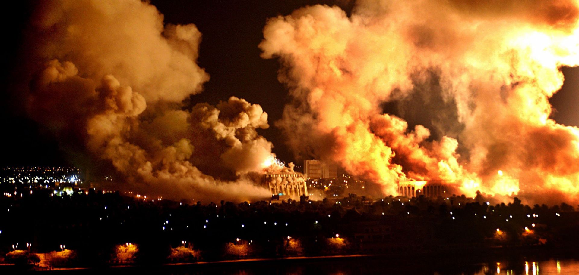 Fires burn on the west bank of the Tigris River in Baghdad, Iraq, on March 21, 2003.