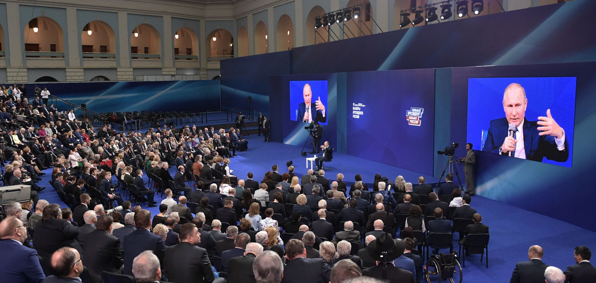 Russian President Vladimir Putin meets with members of his government ahead of March 18 presidential elections.