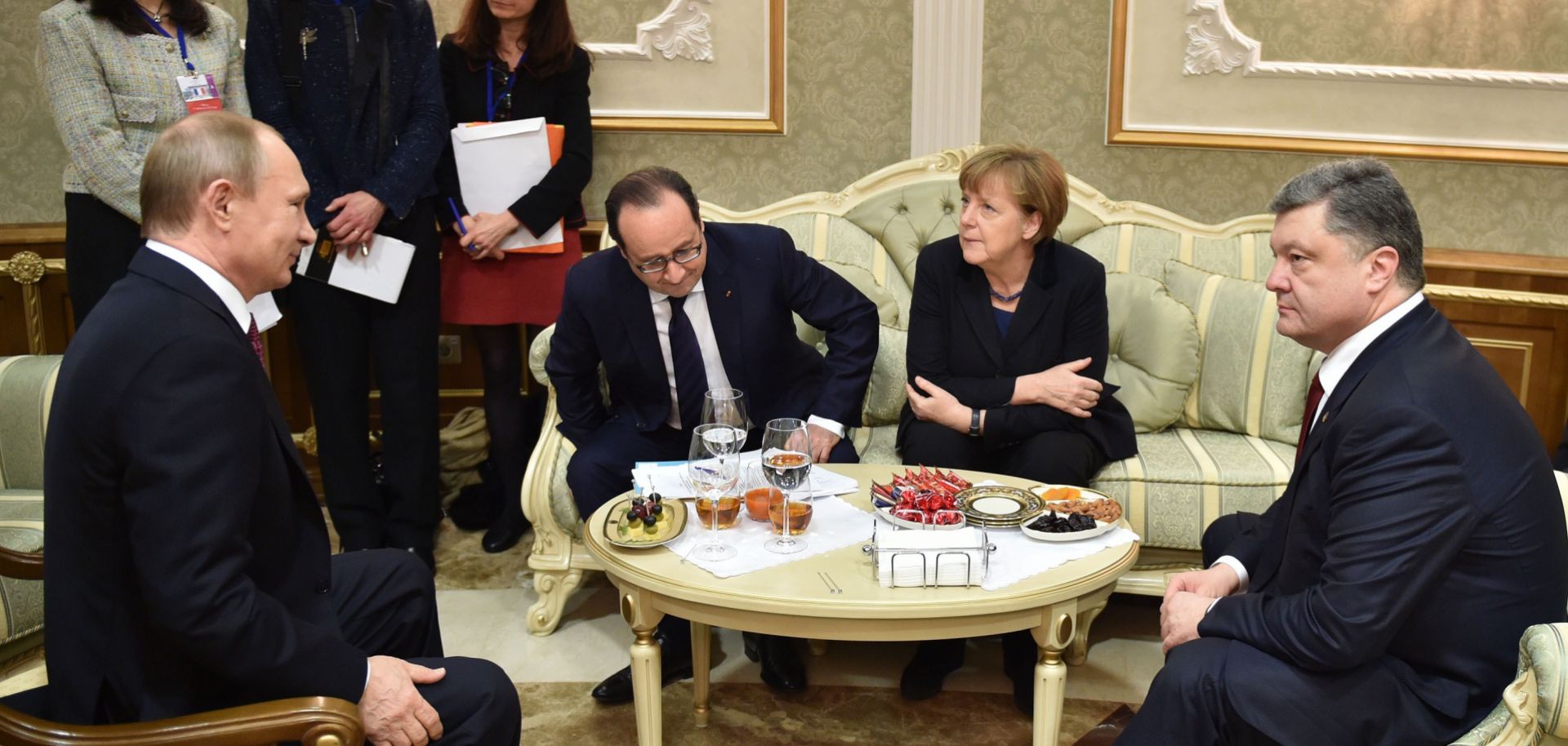 Russian President Vladimir Putin, Former French President Francois Hollande, German Chancellor Angela Merkel and Ukrainian President Petro Poroshenko (L-R) attend a meeting in February 2015 to discuss the conflict in Ukraine. 