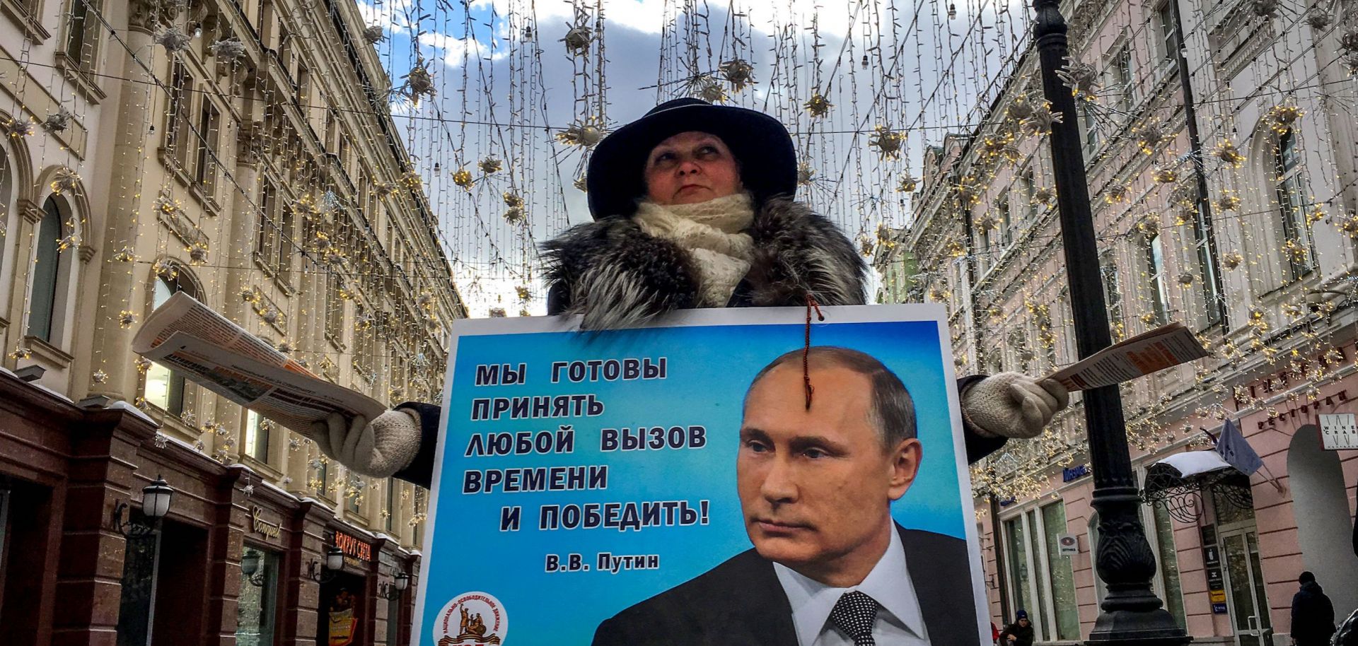 An activist distributes election leaflets in support of Russian President Vladimir Putin in Moscow on March 16.