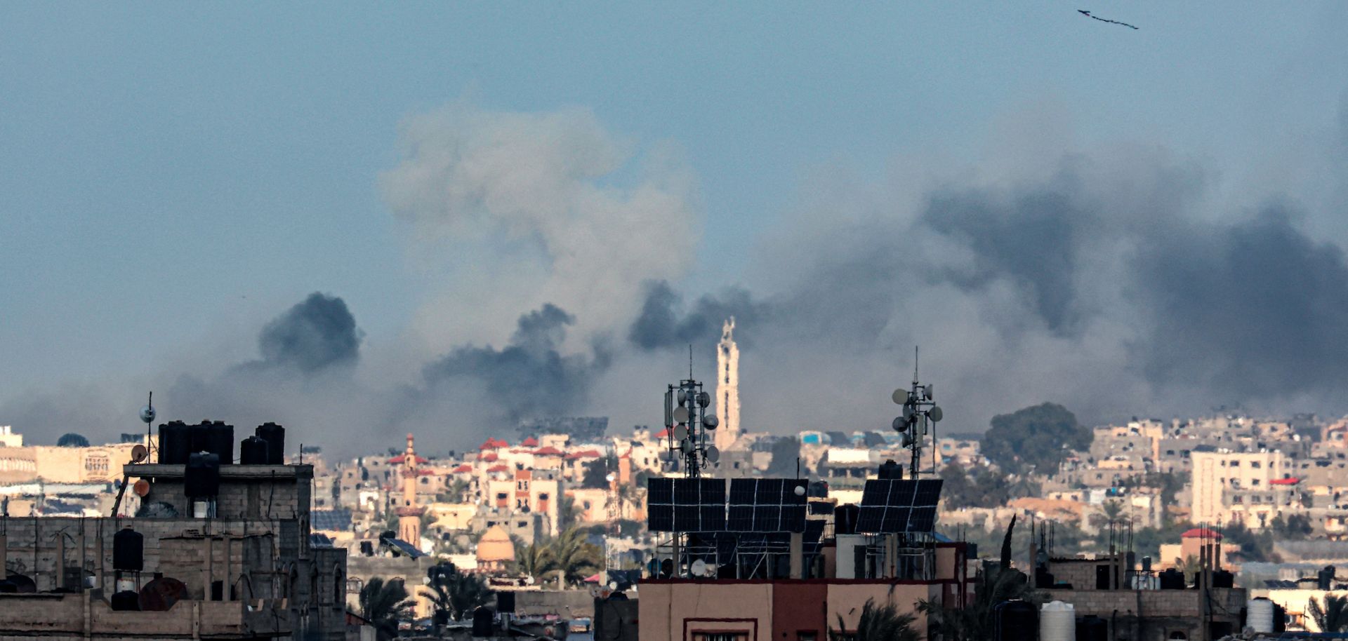A picture taken from Rafah shows smoke billowing over Khan Yunis in the distance following an Israeli bombardment on the southern Gaza Strip on Feb. 14, 2024, amid the ongoing conflict between Israel and the Palestinian militant group Hamas.