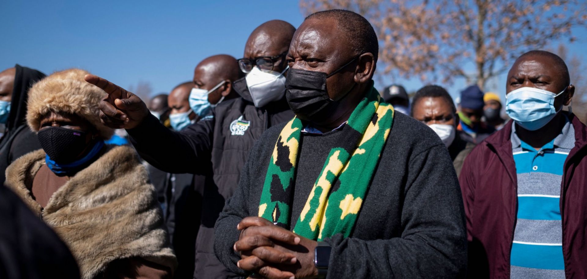 South African President Cyril Ramaphosa (center) visits a mall in Soweto that was damaged by looters on July 18, 2021.
