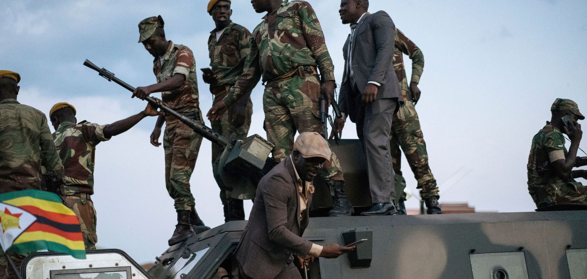 Residents of Harare, the capital of Zimbabwe, thank soldiers on the street after the resignation of President Robert Mugabe.