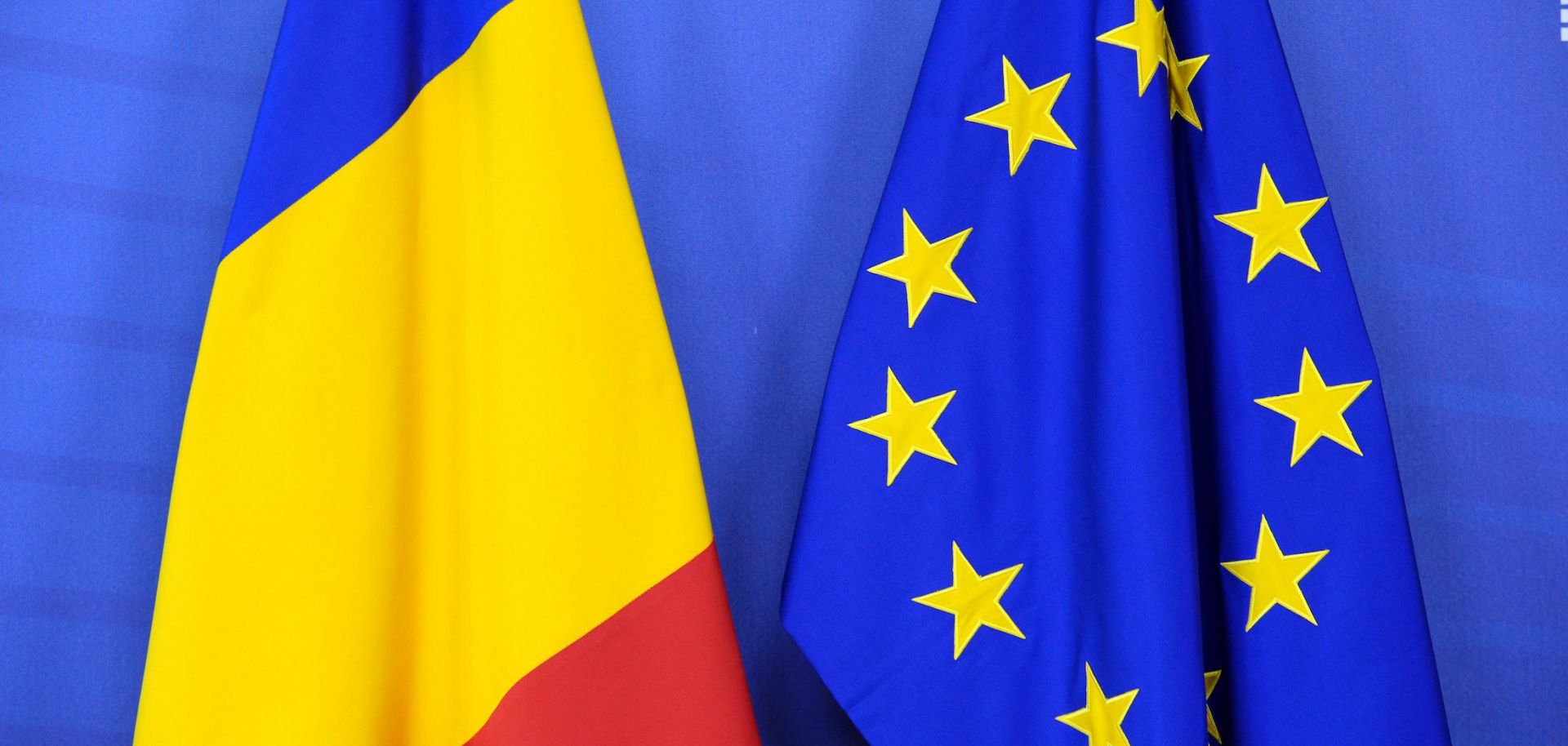 The Romanian and EU flags are seen at the European Commission's headquarters in Brussels, Belgium in February 2017.