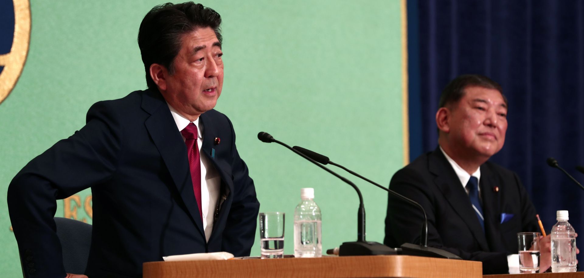 Japanese Prime Minister Shinzo Abe, left, and former Defense Minister Shigeru Ishiba debate in Tokyo on Sept. 14, 2018.