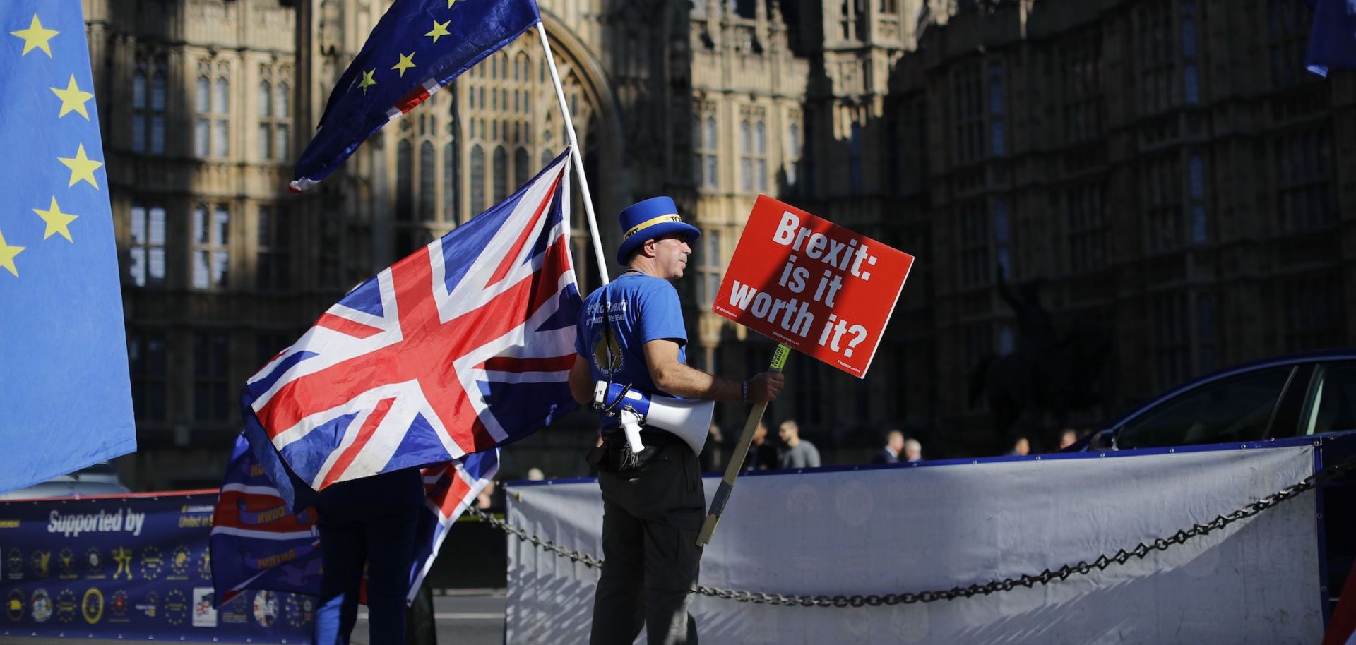 An anti-Brexit protester stands outside the British Parliament in London on Oct. 9, 2018.