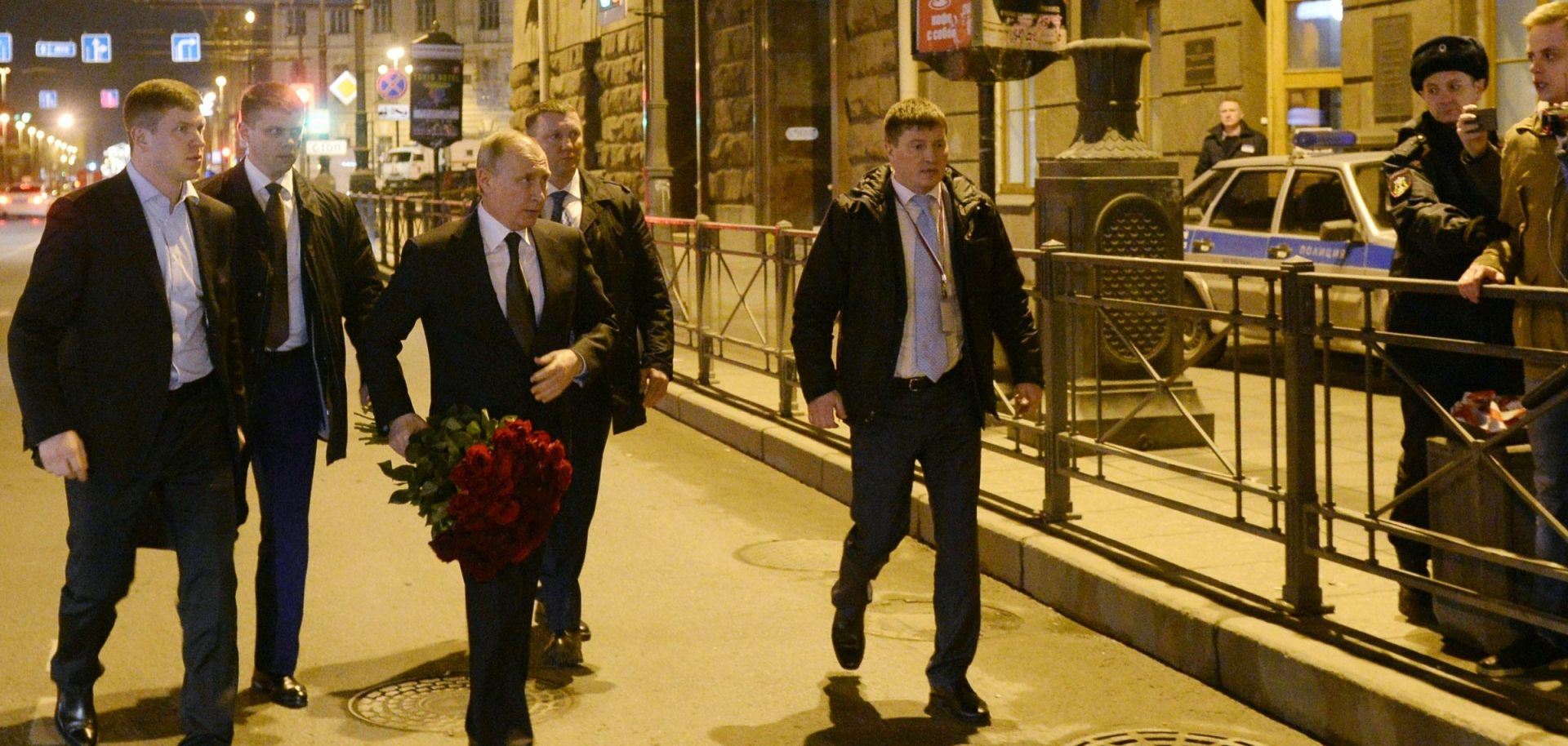 Russian President Vladimir Putin brings flowers to honor the victims of Monday's explosion at St. Petersburg's Technological Institute metro station. Though Putin was in the city at the time of the bombing, he was not its target.