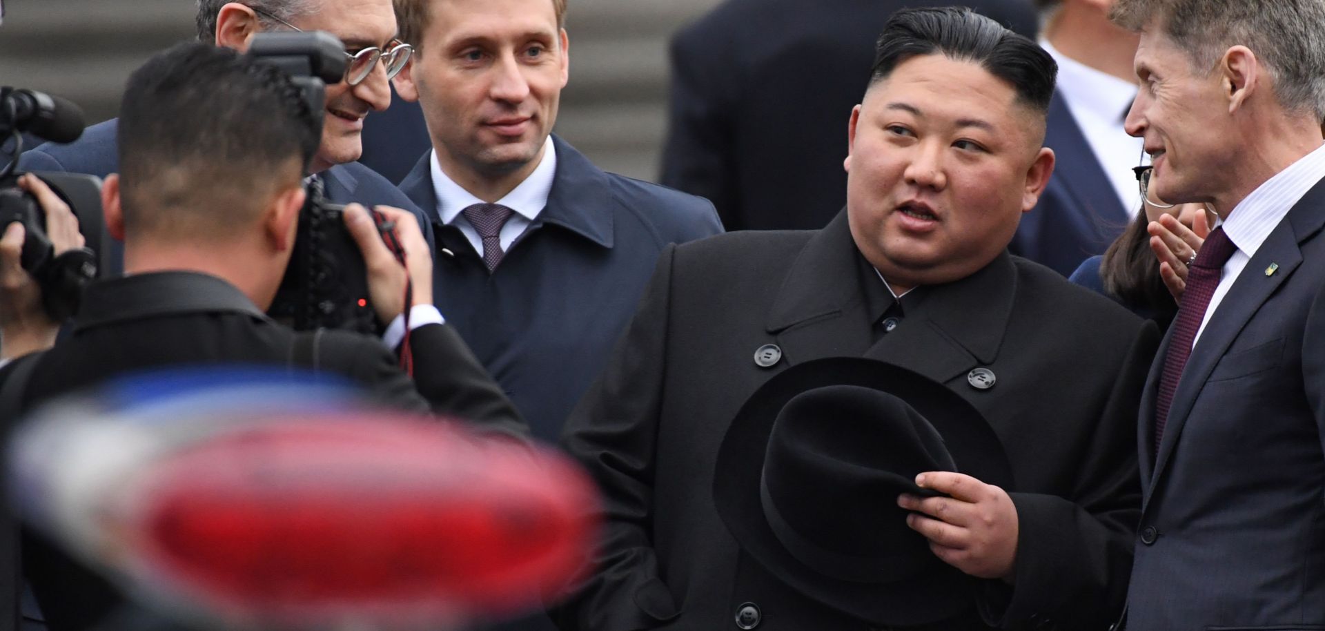 North Korean leader Kim Jong Un (2R) listens to Primorsky Gov. Oleg Kozhemyako (R) upon arrival at the railway station in Vladivostok on April 24, 2019. 