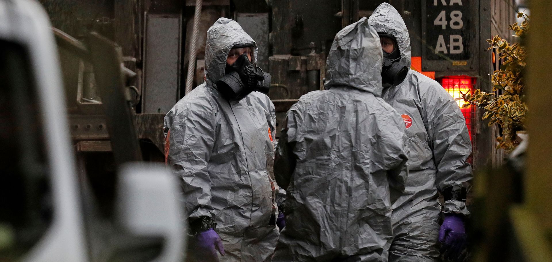British military personnel wear protective clothing while investigating the poisoning of two people in England.