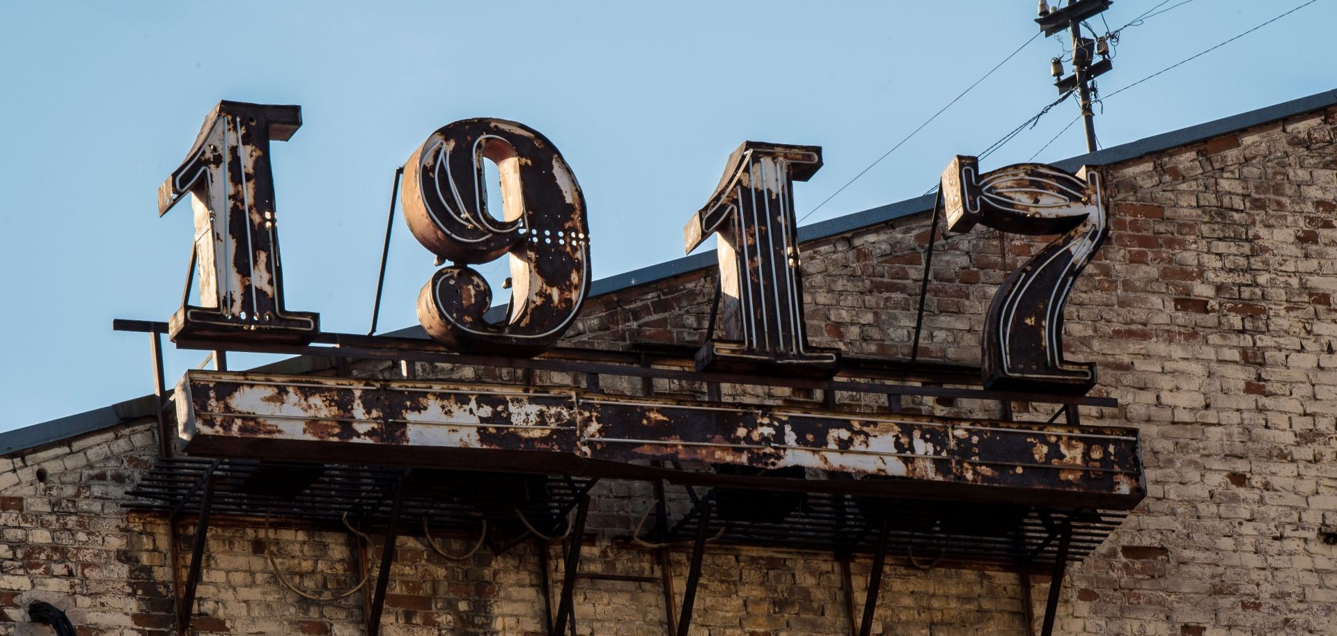 An old sign in downtown Samara references the 1917 Bolshevik Revolution, the centennial of which Russia's government is uneasily observing.