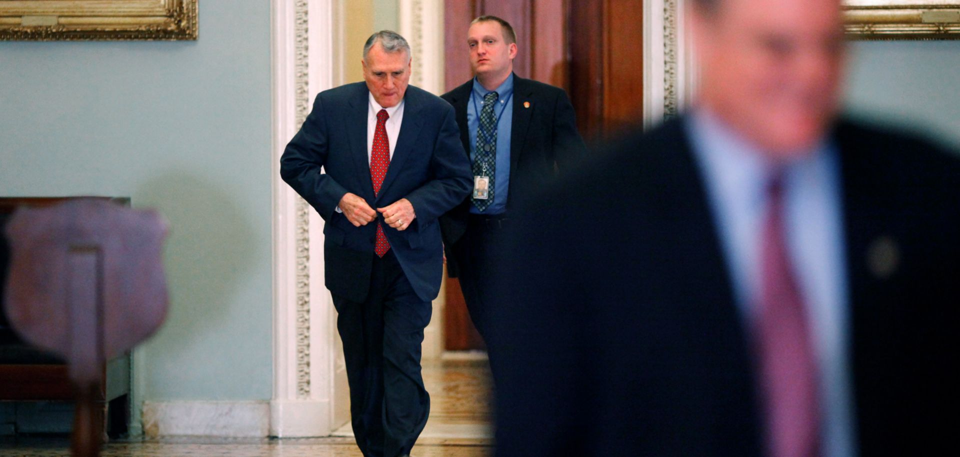 Then-Minority Whip Jon Kyl of Arizona, left, heads for a closed session of the Senate on Dec. 20, 2010, to discuss the strategic arms treaty known as New START.