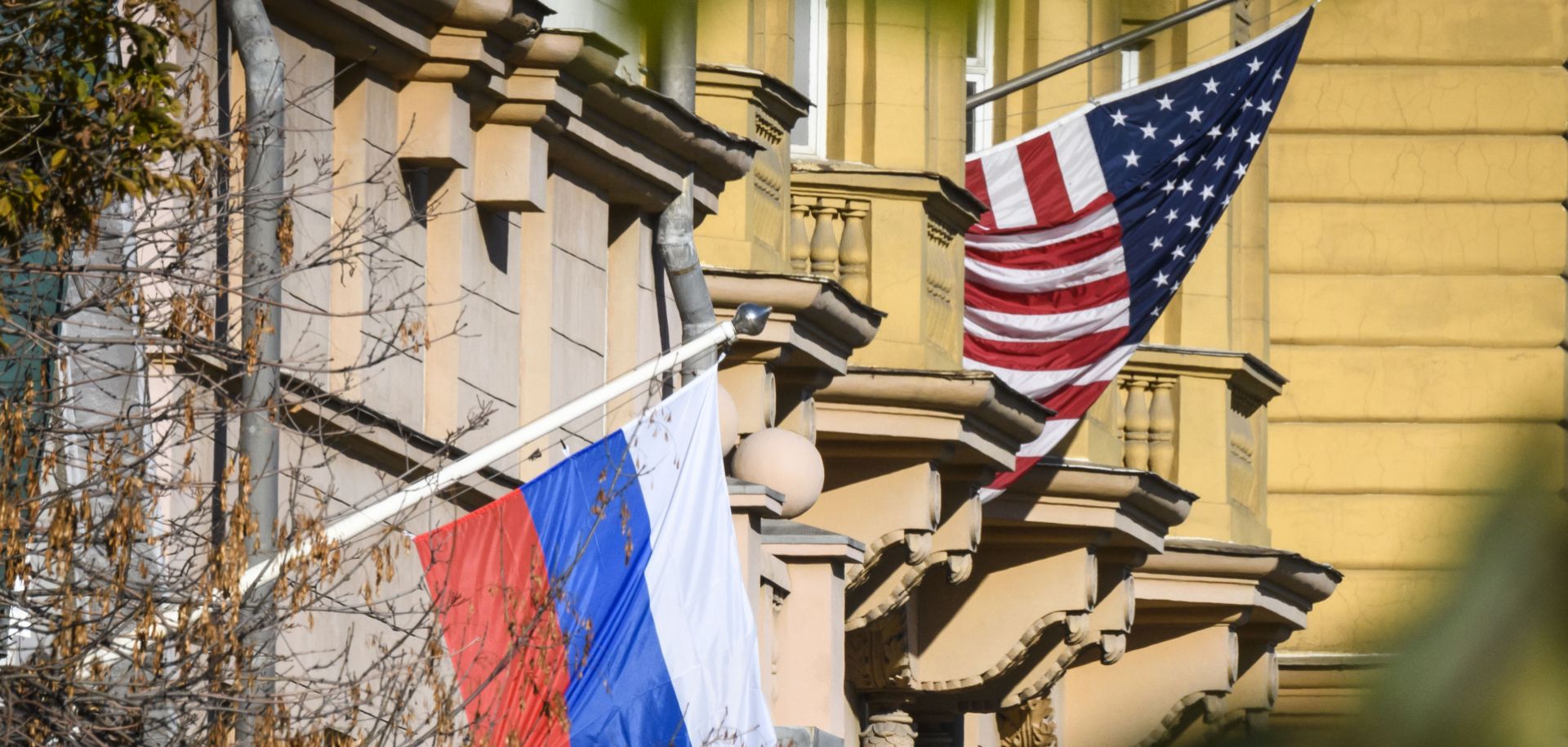 A Russian flag next to the U.S. embassy building in Moscow.