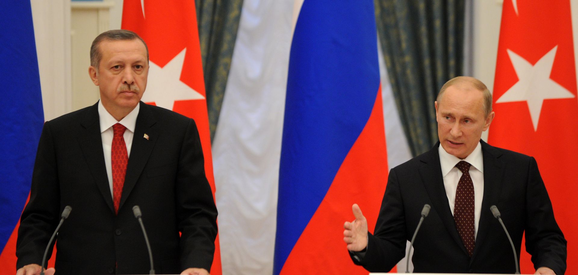 Russian President Vladimir Putin and Turkish Prime Minister Recep Tayyip Erdogan speak during a press conference