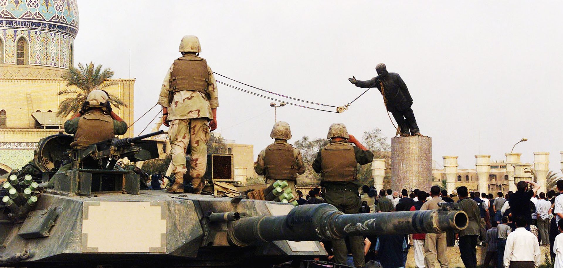 U.S marines and Iraqis are seen on April 9, 2003 as the statue of Iraqi dictator Saddam Hussein is toppled at al-Fardous square in Baghdad, Iraq. The third year anniversary since the overthrow of Saddam Hussein will be marked on April 9, 2006 amidst continued unrest in Iraq, where over 30, 000 civilians have been reported to be killed since the start of the war.