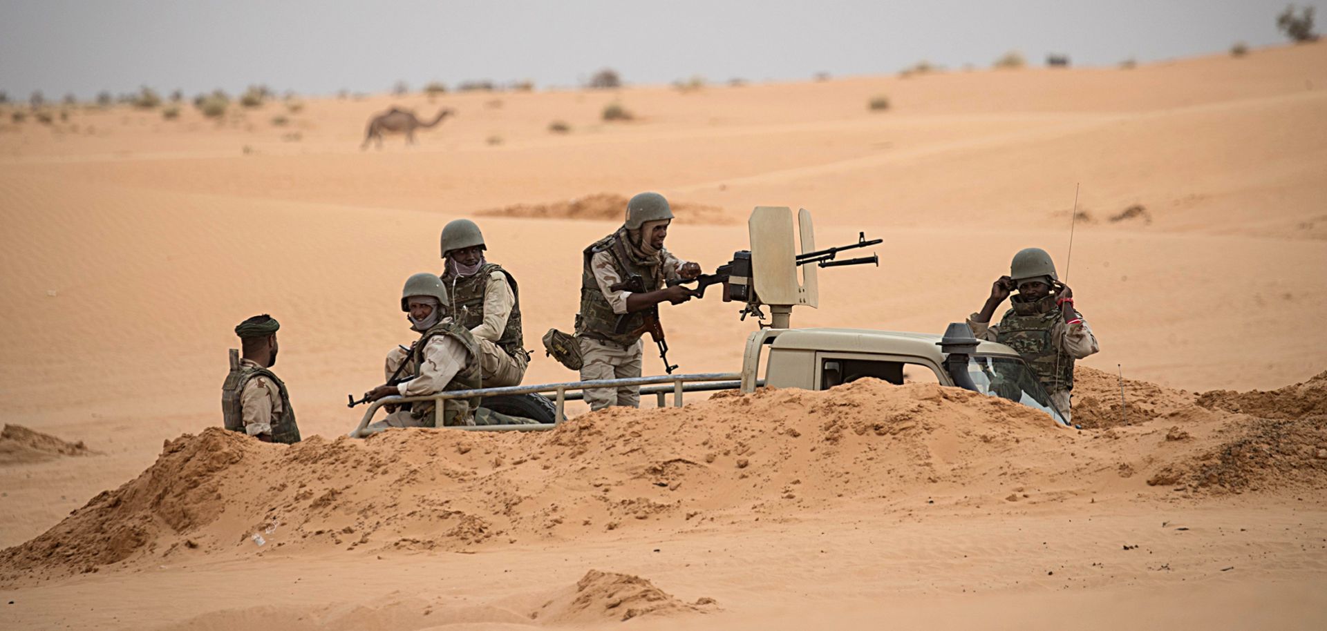 Soldiers stand guard at a G5 Sahel task force command post on Nov. 22, 2018, in Mauritania near the border with Mali.